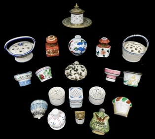 Twenty pieces of ceramics, including flower frogs, miniature half-round planters, inkwells, and