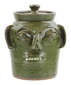 +FOLK ART POTTERY: Burlon Craig (Vale, N.C.,1914–2002) pottery jar with primitive/ grotesque face