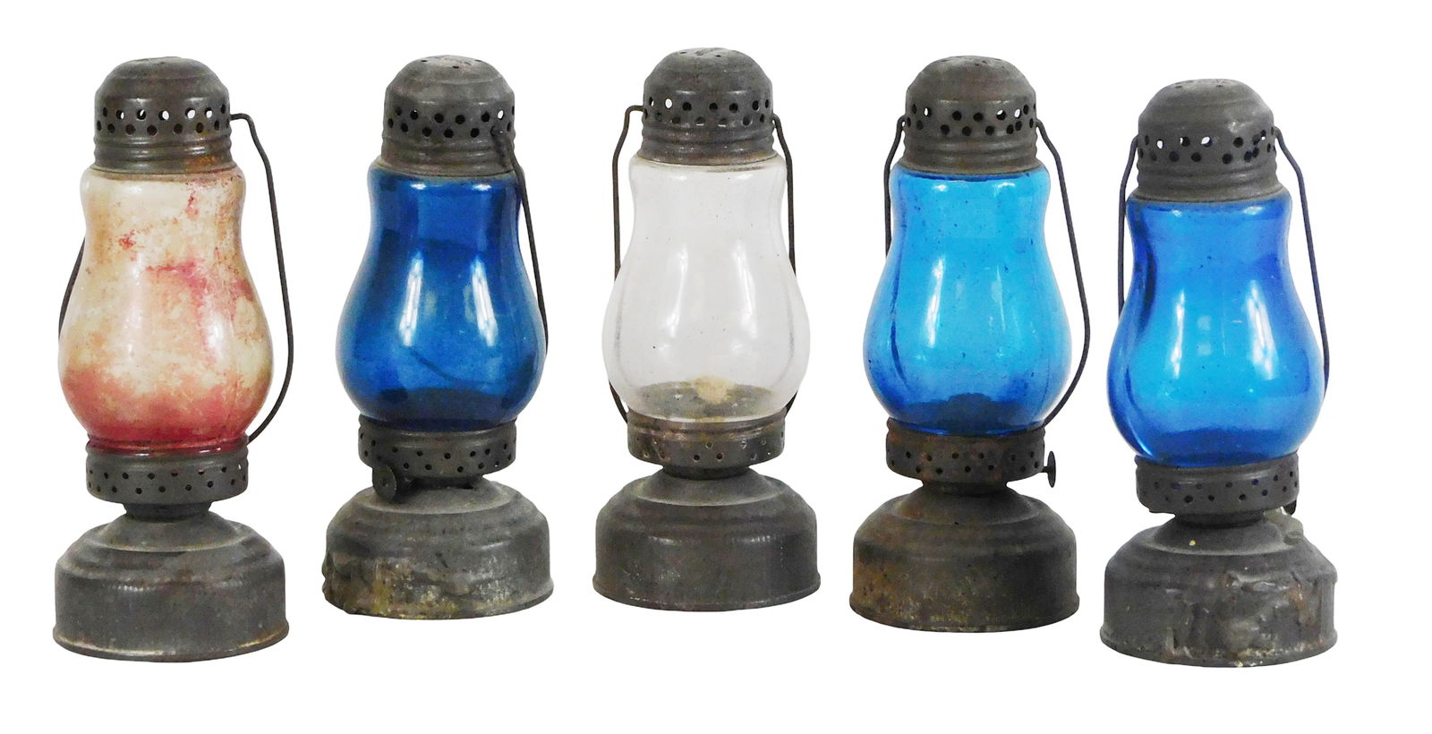 Five skater's lamps, late 19th/early 20th C., metal with glass globes, each marked "Jewel" on top,: Five skater's lamps, late 19th/early 20th C., metal with glass globes, each marked "Jewel" on top, three in blue glass, one clear, and one red, all with handles, perforated cap and circular-form font,