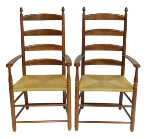Pair of finely made Shaker style ladderback armchairs, 20th C., cherry, acorn finials, shaped arms