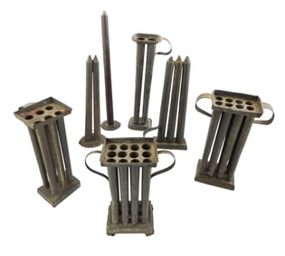 Seven early American tin candle molds, variety of sizes, including: three molds with handles on both