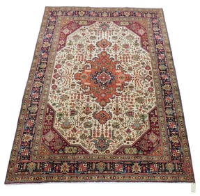 RUG: Tabriz carpet, 8' x 11', wool on cotton, finely woven, unusual design with geometric and floral