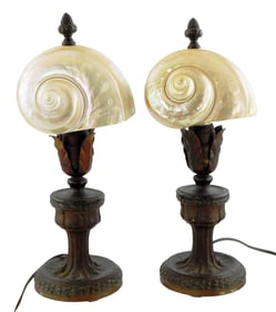 Pair of nautilus shell boudoir lamps, 20th C., cast metal bases with bronzed finish, decorated with