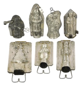 CHOCOLATE MOLDS: Seven Christmas themed molds, details include: older French Father Christmas mold,