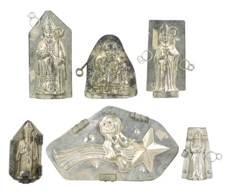 CHOCOLATE MOLDS: Six Christmas themed molds, including: largest an unusual oblong mold by Matfer of