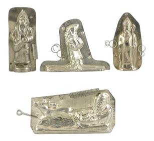 CHOCOLATE MOLDS: Four Christmas themed molds, including: German "Santa on Skiis", stamped "H. Walt,