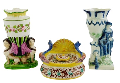 Two pearlware spill vases and faience inkwell, one vase with double sphinx design, the other a