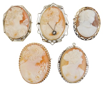 CAMEOS: Five Cameo pin/pendants, in stamped 14K gold frames, traditional orange and white shell