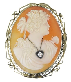 JEWELRY: 14K Cameo diamond pin/pendant, set with one oval carved shell cameo, 45mm x 35mm, carved