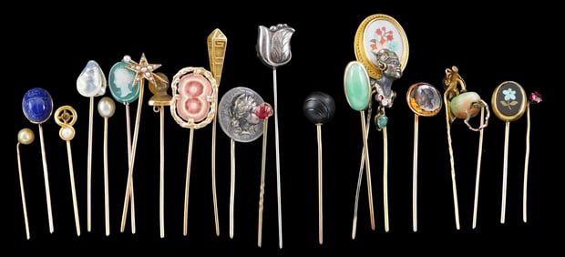 JEWLRY: Twenty plus stick pins, stamped or tested 14k, along with three silver stick pins, adorned