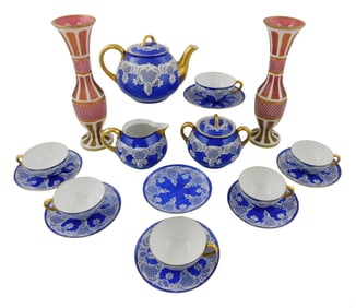 Venetian tea set and Bohemian glass, sixteen pieces in porcelain, cobalt blue with lace detail and