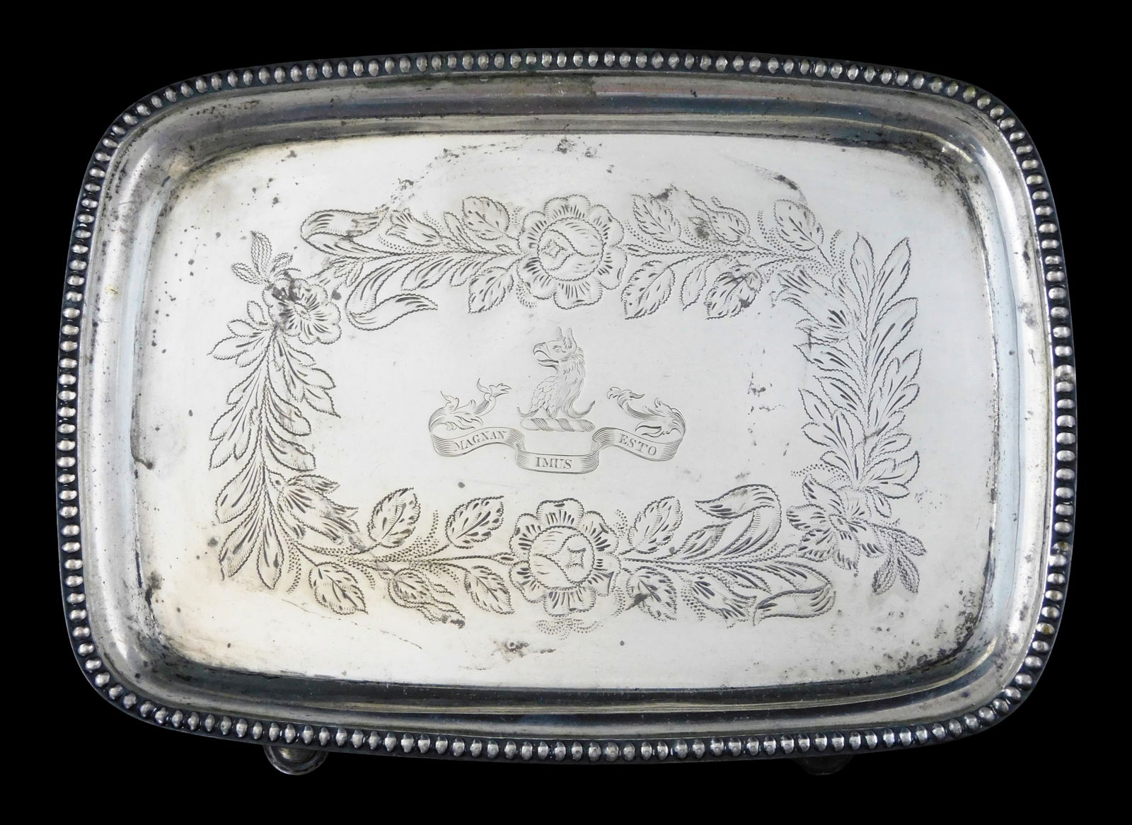 SILVER: Early Southern silver salver by John Ewan (South Carolina, 1776 -1853), oblong with beaded: SILVER: Early Southern silver salver by John Ewan (South Carolina, 1776 -1853), oblong with beaded edge, chased decoration of coat of arms, raised on four feet, maker's mark J. on reverse of tray, wea