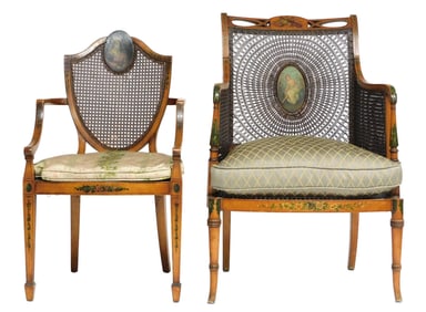 +Two Adams-style painted and caned satinwood armchairs, late 19th C., the first an arm chair with