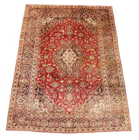 RUG: Fine Kashan, 8' x 11', wool on cotton, central medallion on a cranberry ground, taupe primary