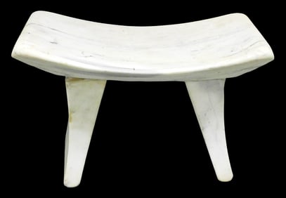 White marble stool, concave seat, white stone with grey veining, wear consistent with age and
