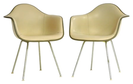 Two Charles and Ray Eames for Heman Miller Dax molded fiberglass and vinyl armchairs, designed in