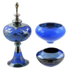 ART GLASS: Three pieces including two studio glass bowls, both blue, taller with metallic interior,