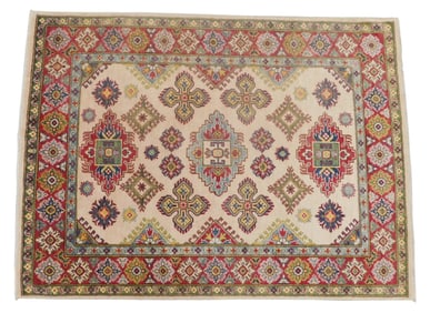 RUG: Kazak, 5' x 6' 8", c. 1990, wool on cotton, off cream ground, red border, green minor border,
