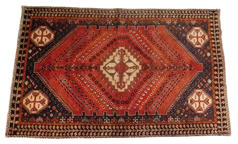 RUG: Quashqai, 5' x 8', wool on wool, 1940's, "Tree of Life" design on red ground, navy border, wear