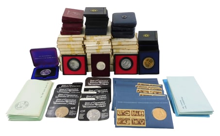 COINS: (Box Lot) Containing US mint medals and coins. Includes: thirty-two bronze (or pewter)