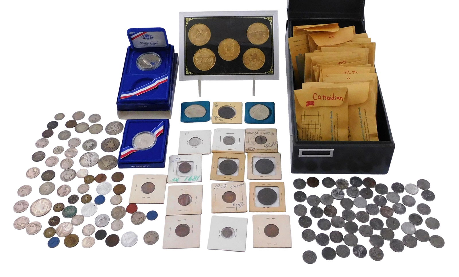 COINS: Lot of US and world coins. Includes a metal file box with approximately 200 wheat cents in (1 of 4)