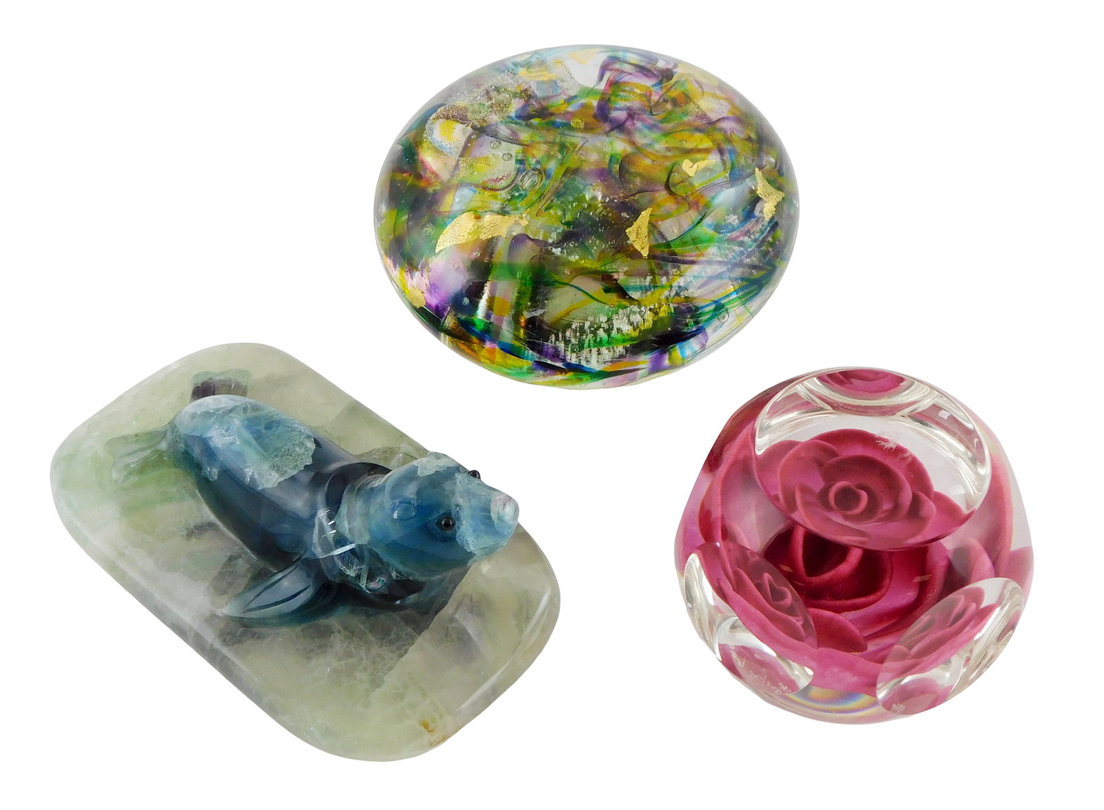 ART GLASS: Three decorative paperweights, including: fluorite seal sculpture paperweight, (1 of 6)