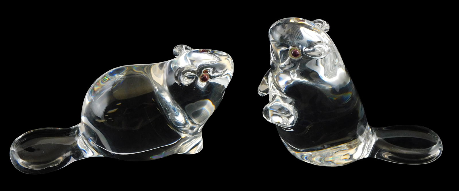 ART GLASS: Pair of Steuben beavers with red colored eyes, both signed, one seated and one rearing, (1 of 5)