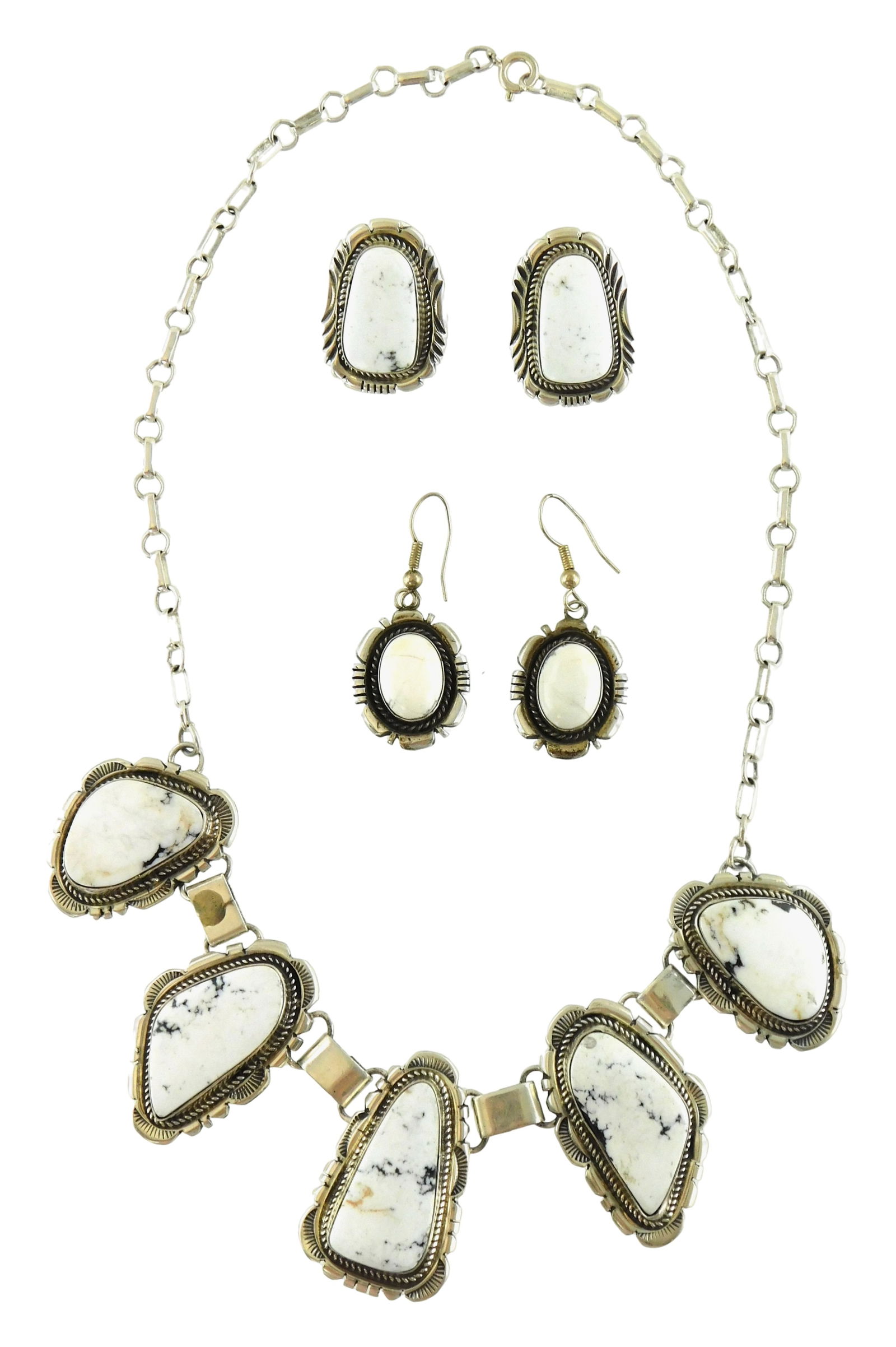 JEWELRY: Five pieces of Jerry Johnson (Native American, b. 1964) sterling Navajo southwest jewelry,: JEWELRY: Five pieces of Jerry Johnson (Native American, b. 1964) sterling Navajo southwest jewelry, including a lariat necklace with five white buffalo stones, all set in sterling silver, marked sterl