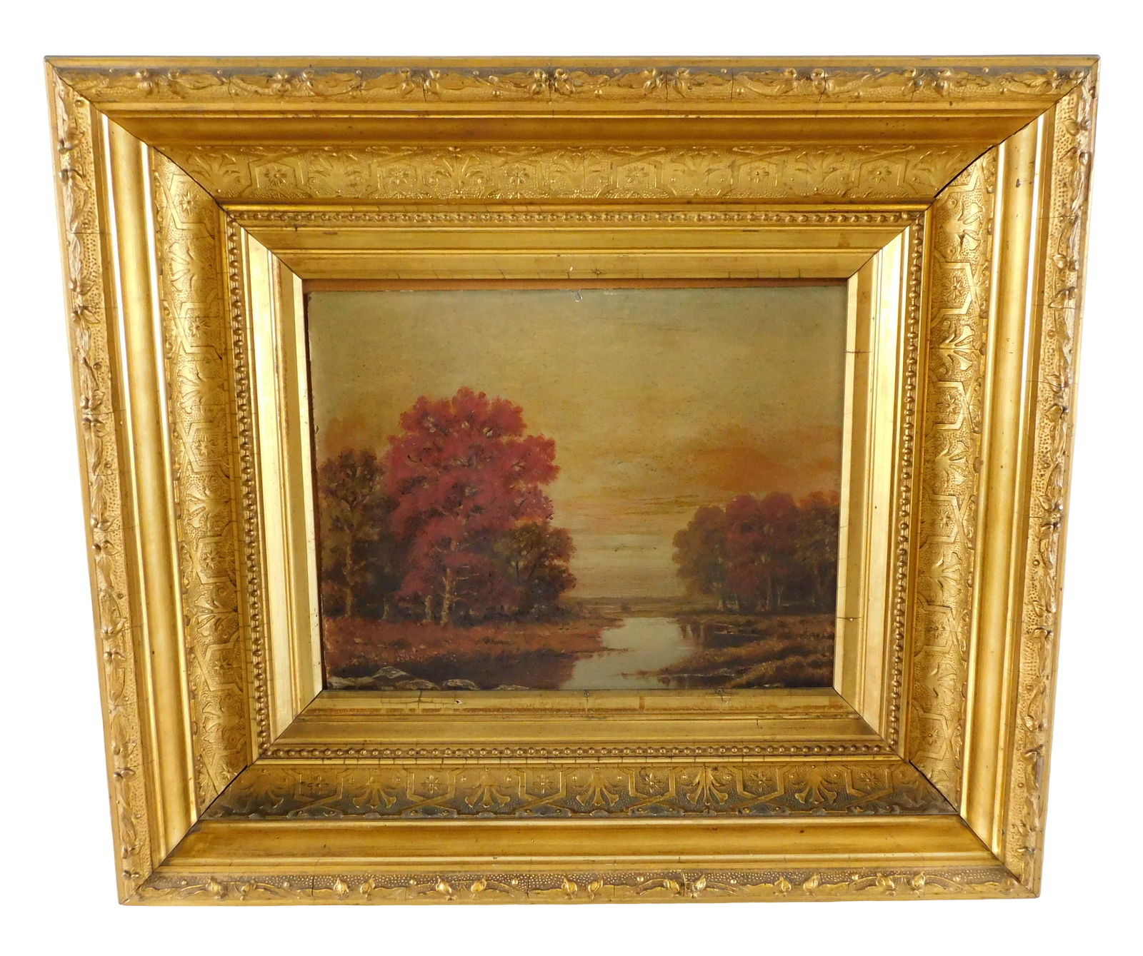Autumn landscape, 19th C., oil on board, low horizon line with red trees and stream, oil on rigid: Autumn landscape, 19th C., oil on board, low horizon line with red trees and stream, oil on rigid support, slipped in frame, no signature viewed, gilt frame, wear consistent with age, 7 1/4" x 9 1/4".