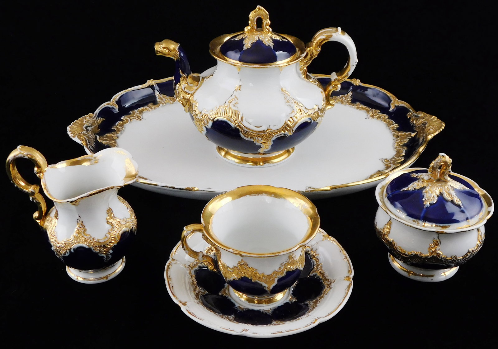 CHINA: Meissen "B-Form" Rococo Revival tea set, six pieces, mid 19th C.- early 20th C., German,: CHINA: Meissen "B-Form" Rococo Revival tea set, six pieces, mid 19th C.- early 20th C., German, developed by artist/ designer Ernst August Leuteritz between 1844 - 1855, features 23 karat gold leaf an
