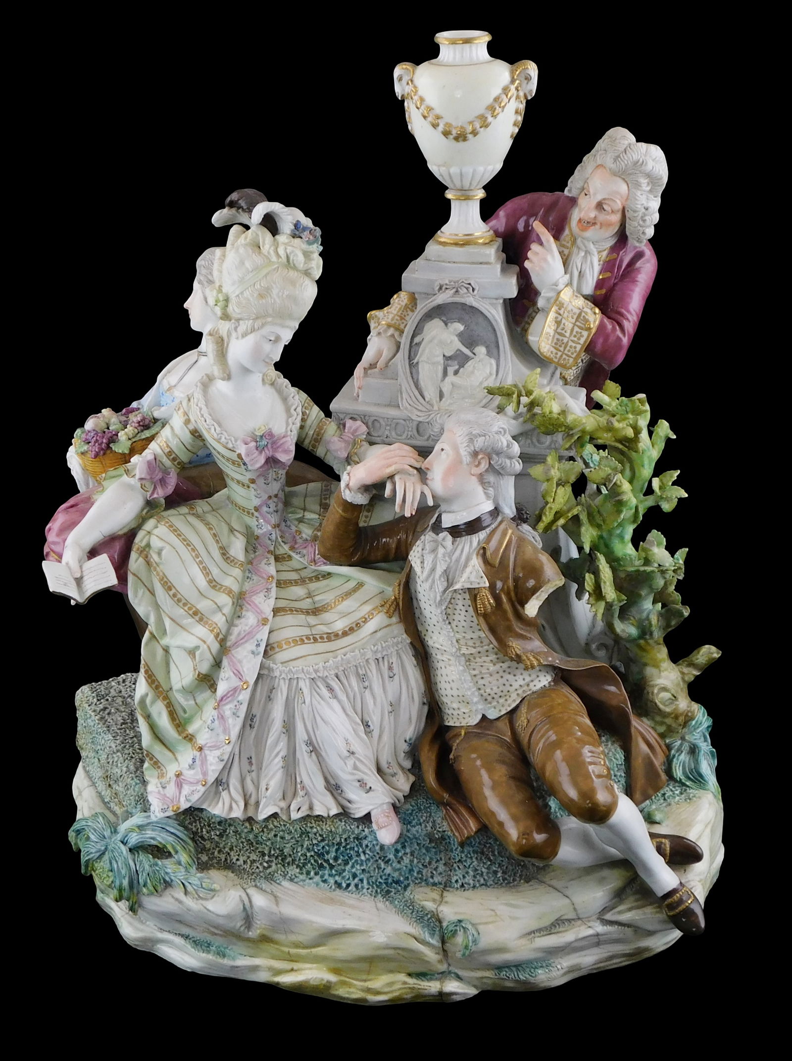 Meissen style figural group, 19th C. or earlier, of four figures in 18th C. dress, glazed porcelain,: Meissen style figural group, 19th C. or earlier, of four figures in 18th C. dress, glazed porcelain, courting couple at center with female attendant and older gentleman at sides, large memorial urn tr