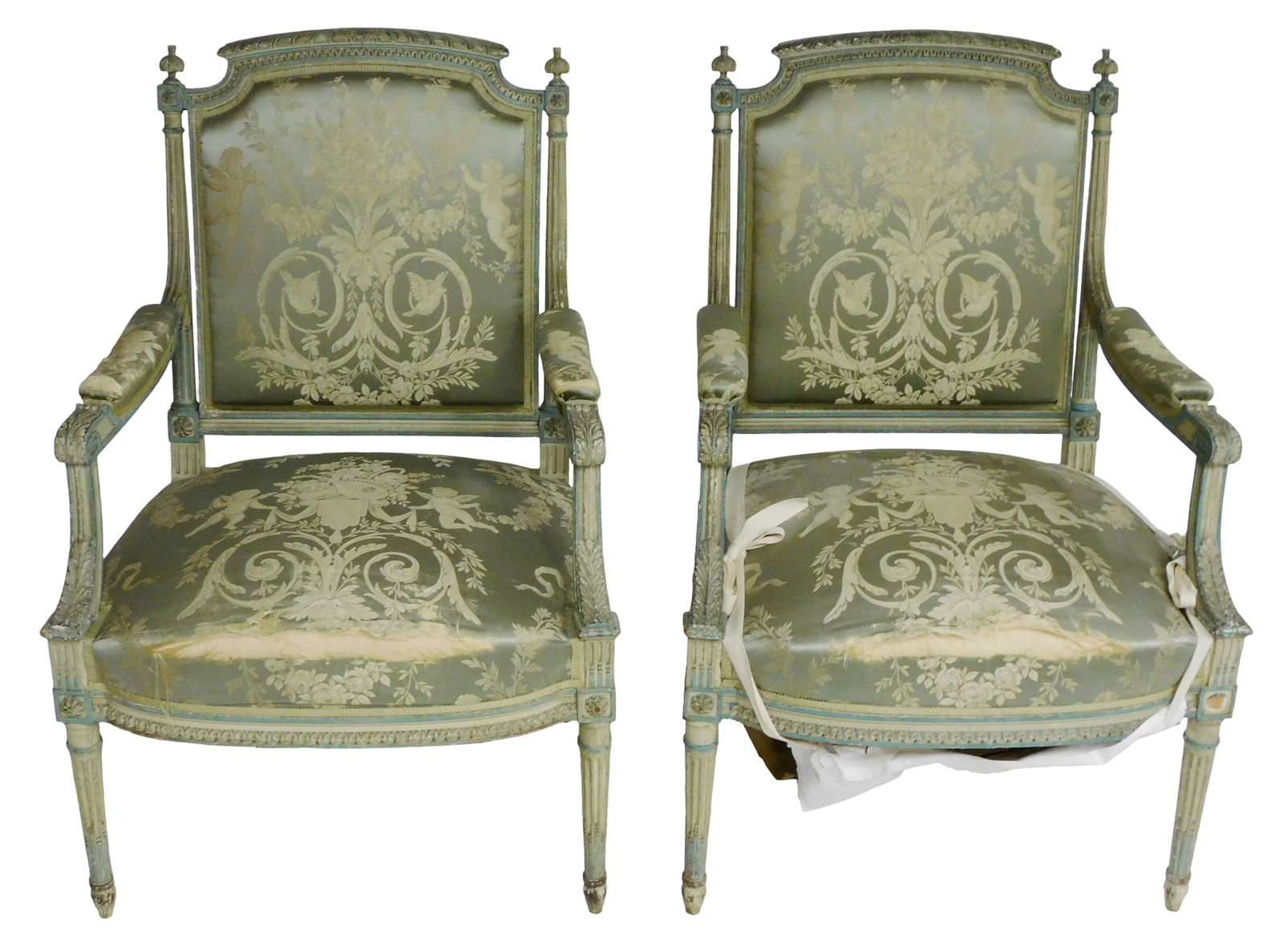 Pair of upholstered armchairs, likely French, late 19th/early 20th C., wood frame with gesso cream: Pair of upholstered armchairs, likely French, late 19th/early 20th C., wood frame with gesso cream and blue paint, carved crest, finials, fluted stiles, arms acanthus carved and legs, bowed carved fro