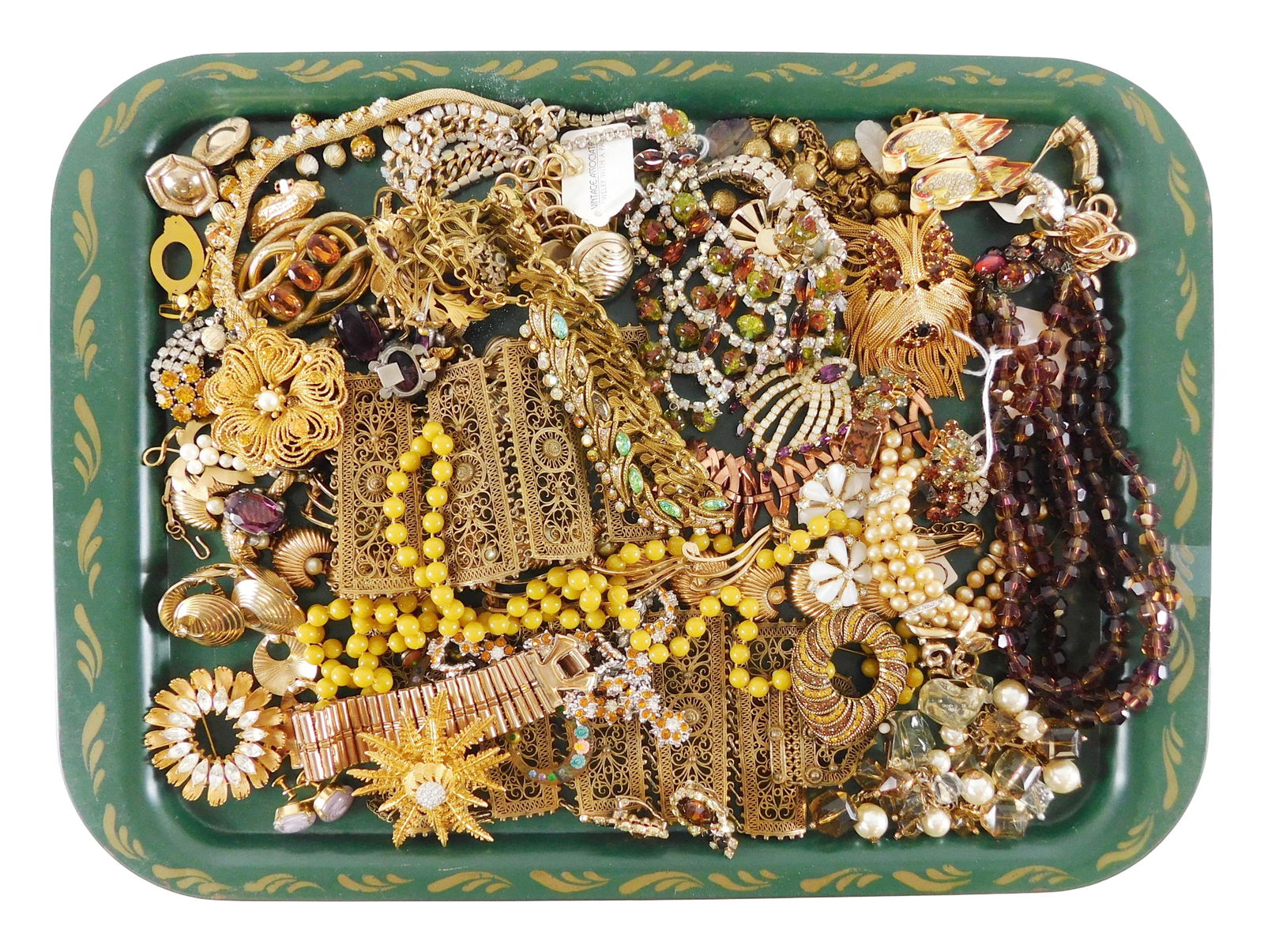 COSTUME JEWELRY: Warner, Coro, Trifari, etc., 45+ pieces, many bejeweled in colors of citrine and: COSTUME JEWELRY: Warner, Coro, Trifari, etc., 45+ pieces, many bejeweled in colors of citrine and lavender, materials include, gold-plated, gold-toned, silver-toned and with faux faceted stones, rhine
