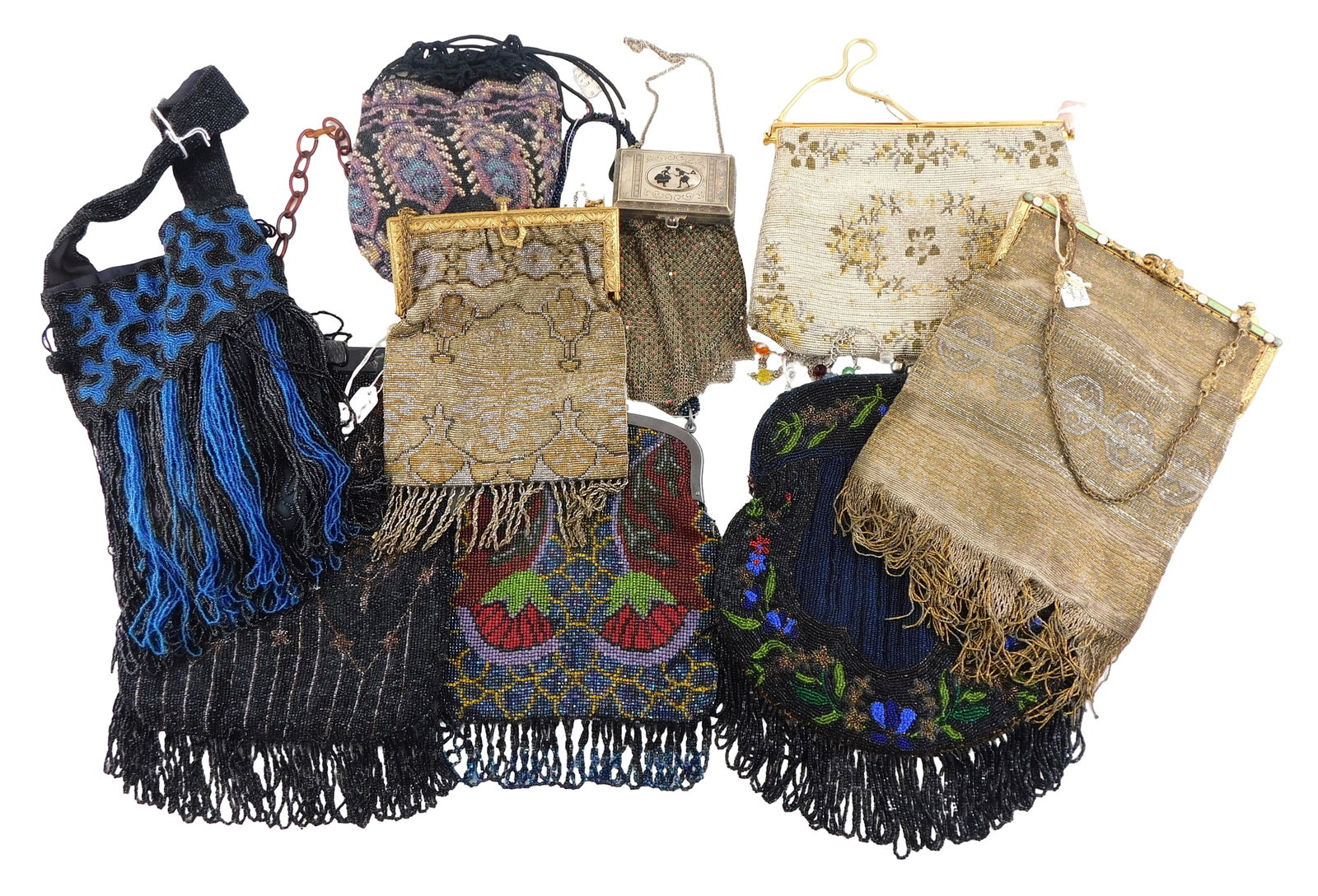 Nine seed beaded and metal mesh purses, details include: Whiting & Davis enameled metal mesh purse: Nine seed beaded and metal mesh purses, details include: Whiting & Davis enameled metal mesh purse with built-in compact including comb, five purses with black seed beaded designs, one with lucite cla