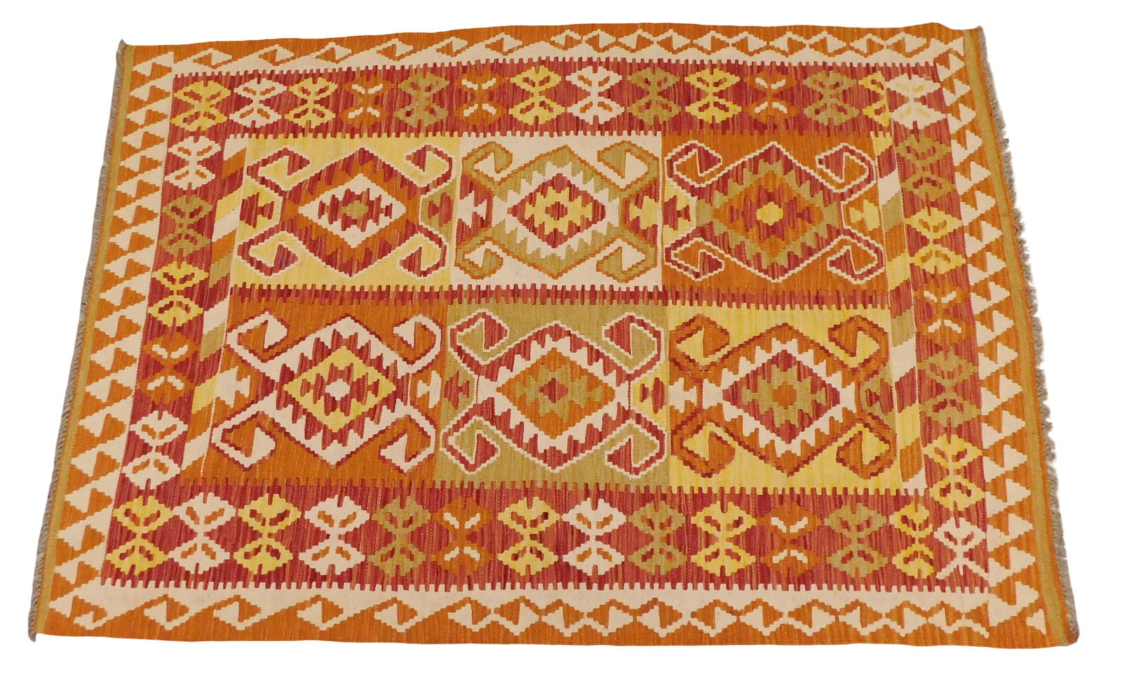 RUG: Turkish Kilim, 4' 5" x 6' 5", wool on wool, red and orange geometric design on cream ground,: RUG: Turkish Kilim, 4' 5" x 6' 5", wool on wool, red and orange geometric design on cream ground, wear consistent with age and use.