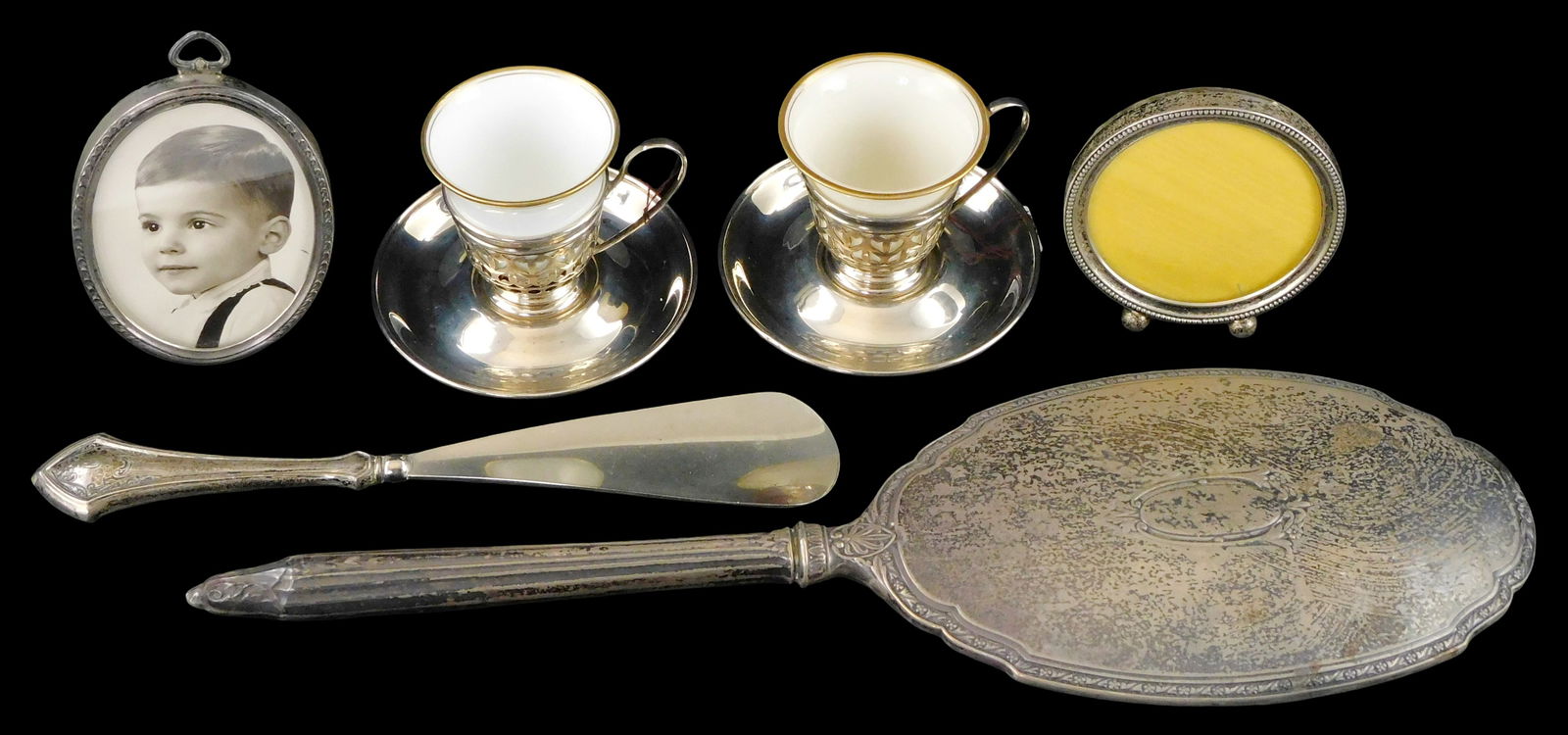 STERLING: Gorham, etc., six pieces, details include: pair of Gorham demitasse cup holder and: STERLING: Gorham, etc., six pieces, details include: pair of Gorham demitasse cup holder and saucers, with Lenox and Rosenthal porcelain liners; two Webster Company sterling picture frames, tallest: 4