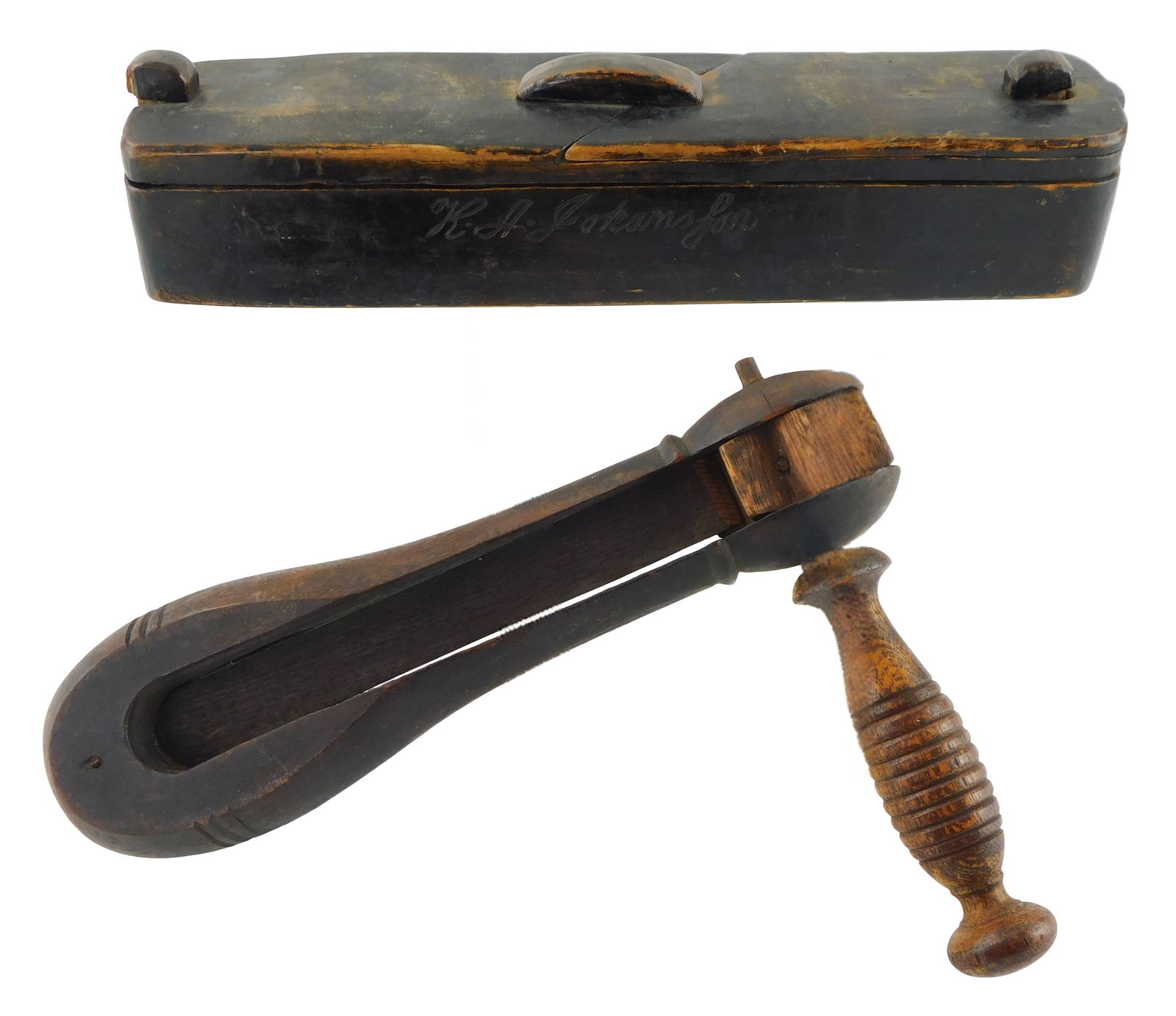 Two carved wood pieces, puzzle box and ratcheting noise maker, 19th-early 20th C., including: wood: Two carved wood pieces, puzzle box and ratcheting noise maker, 19th-early 20th C., including: wood puzzle box, sliding wood top with moving and removable components, dark brown finish, “R.A. Johansf