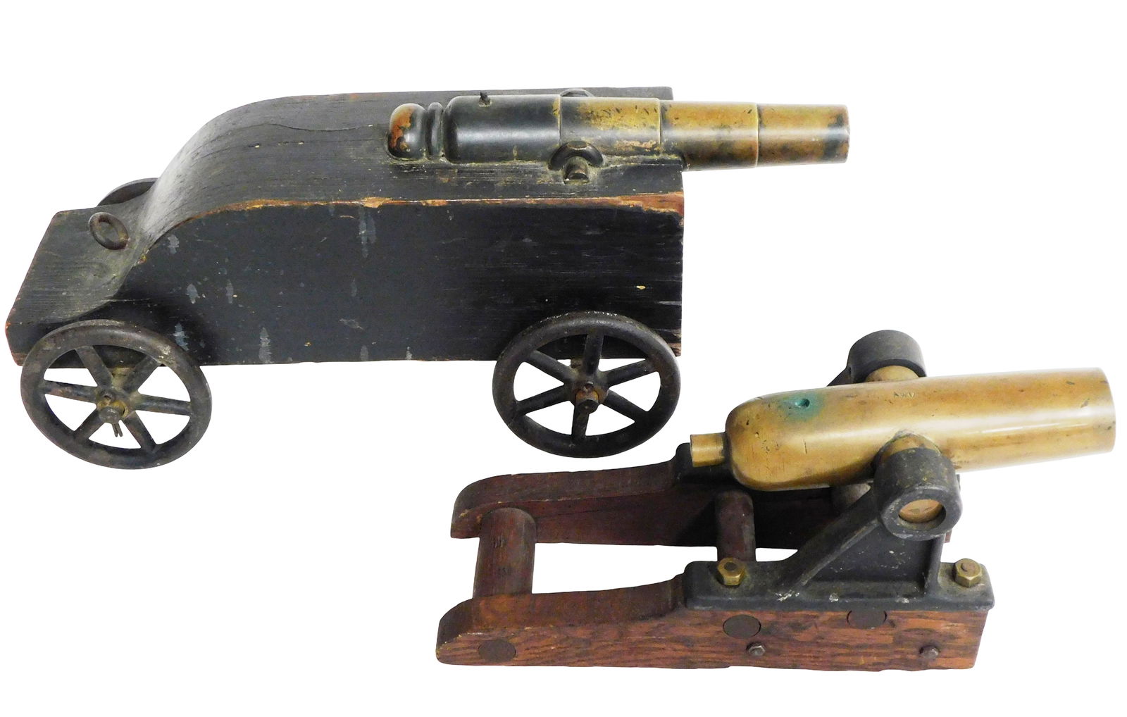 Two brass signal cannons, 19th-20th C., including: cast brass cannon, on wooden stand with iron (1 of 3)