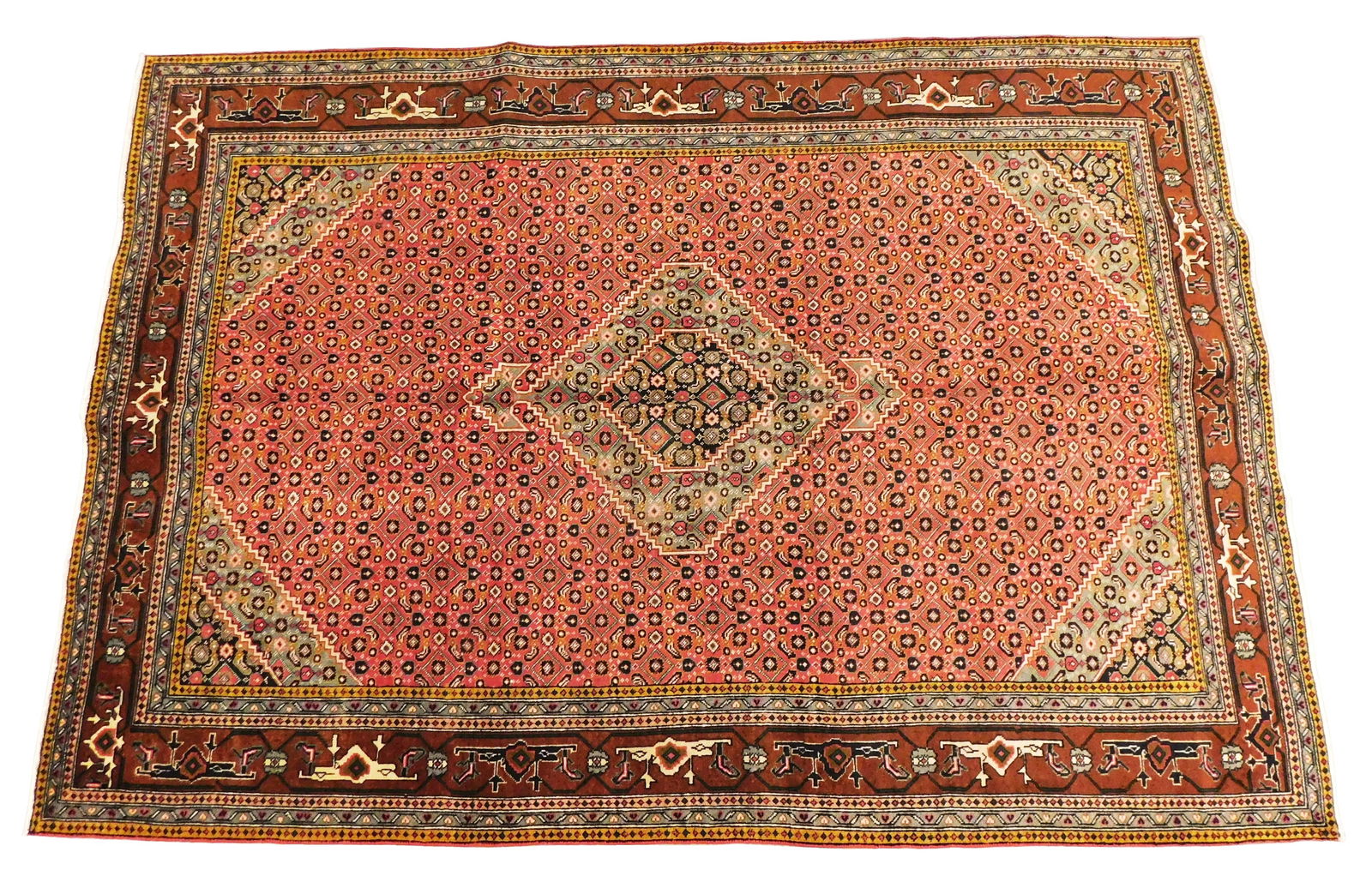 RUG: Fine Bidjar, 7' x 9', wool on cotton, classic geometric designs, rust red ground, green major: RUG: Fine Bidjar, 7' x 9', wool on cotton, classic geometric designs, rust red ground, green major border, wear consistent with age and use.
