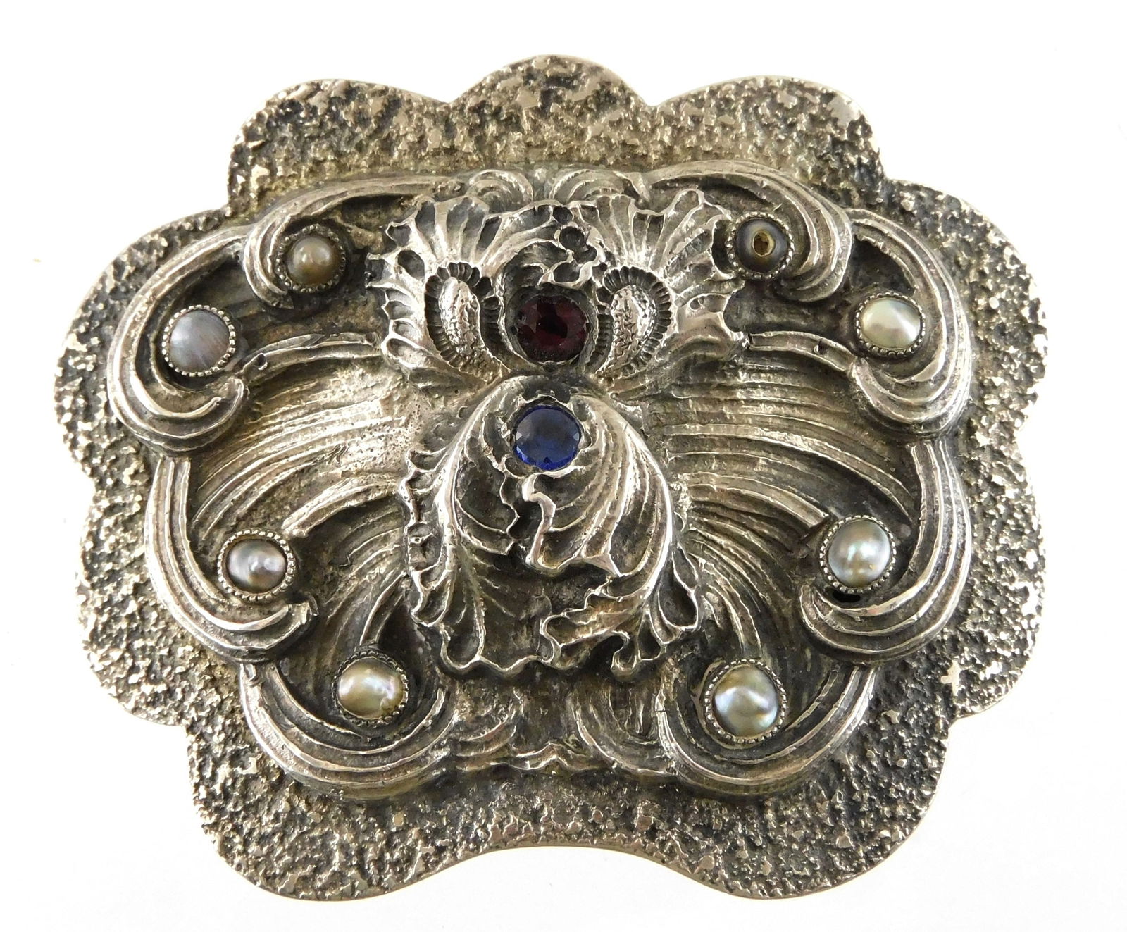 STERLING: Art Nouveau sterling silver belt buckle with inset stones, lobed sides with raised: STERLING: Art Nouveau sterling silver belt buckle with inset stones, lobed sides with raised scrolling shell and foliate design at center, abalone cabochons flank center design, stamped sterling on re
