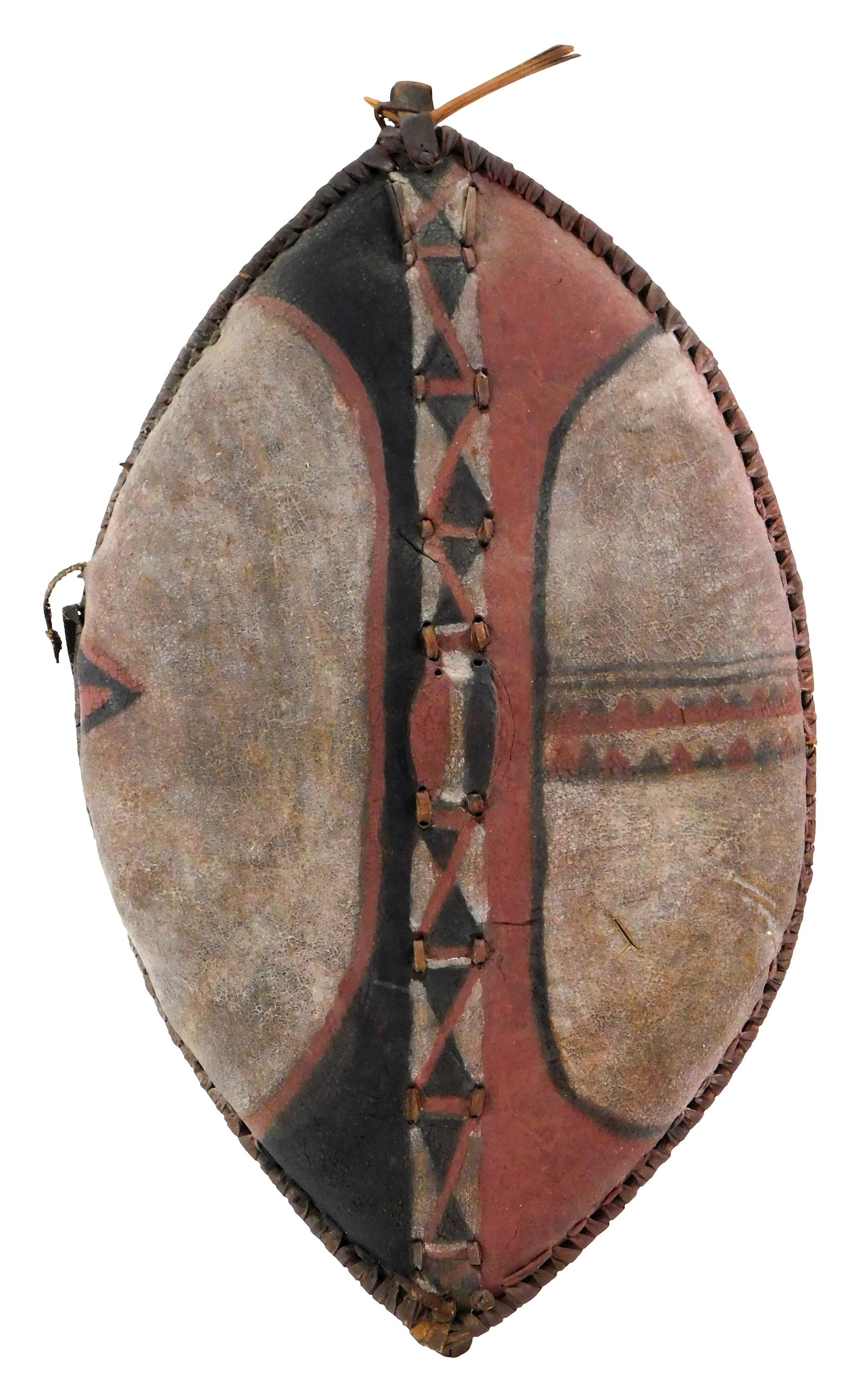 TRIBAL: African Maasai painted hide shield, early to mid-20th C., Kenya, elliptical buffalo hide: TRIBAL: African Maasai painted hide shield, early to mid-20th C., Kenya, elliptical buffalo hide shield with applied red, black and white pigments in geometrical patterns, hide stretched over a wooden