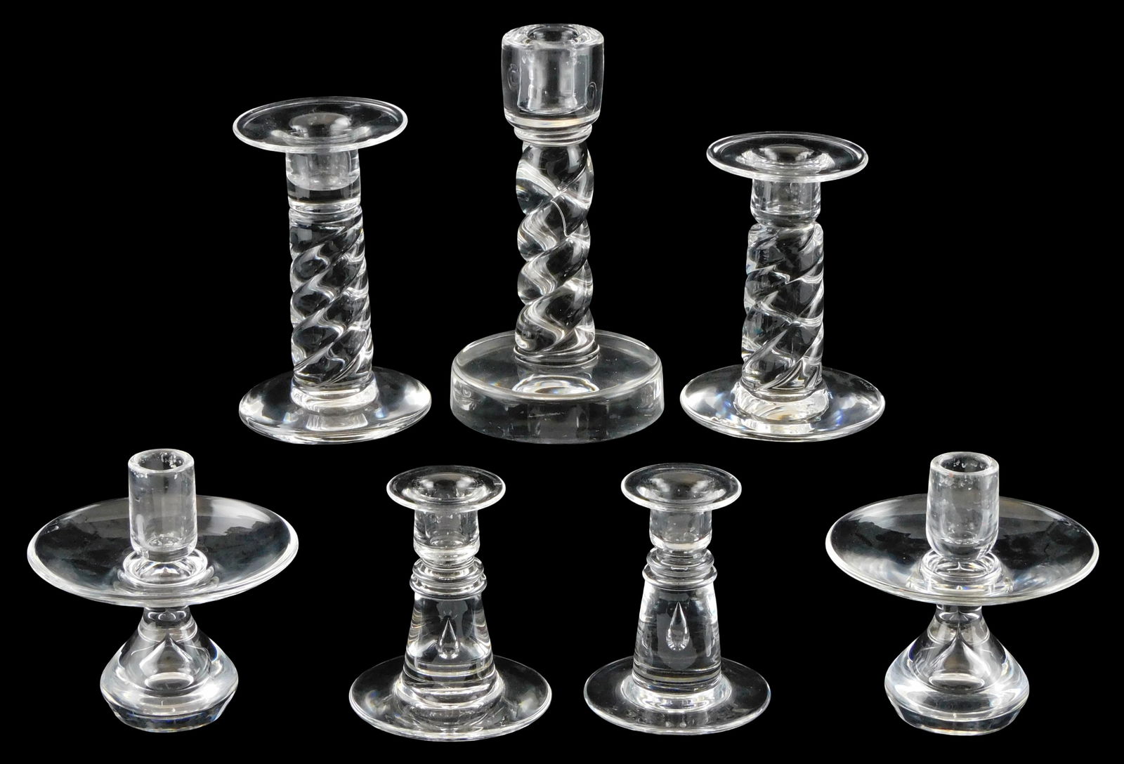 ART GLASS: Seven Steuben candlestick holders, all translucent, all signed, including: pair of “Low (1 of 4)