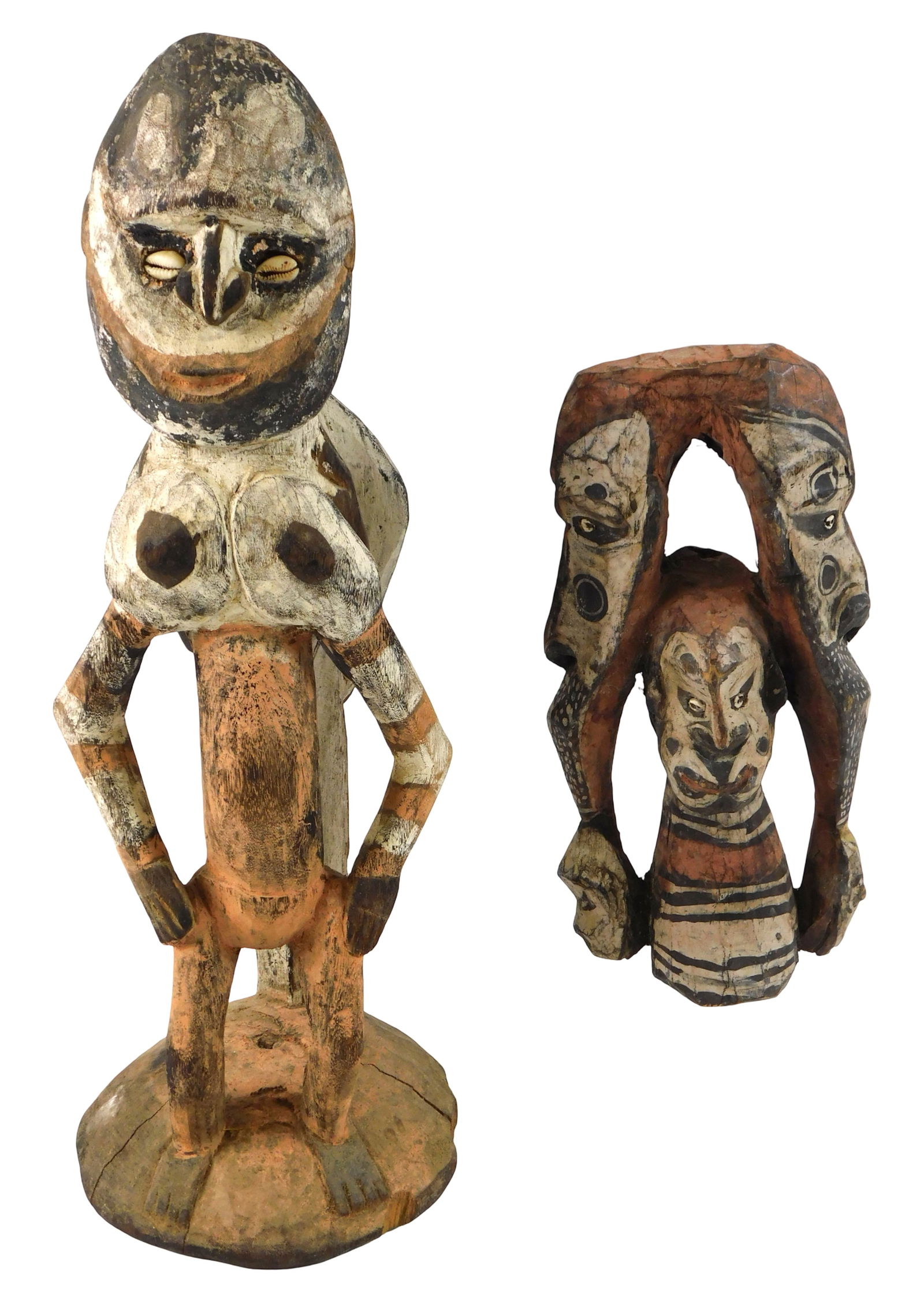 TRIBAL: Two figural carvings, New Guinea, Sepik River region, 20th C., both carved wood, white, pink (1 of 3)