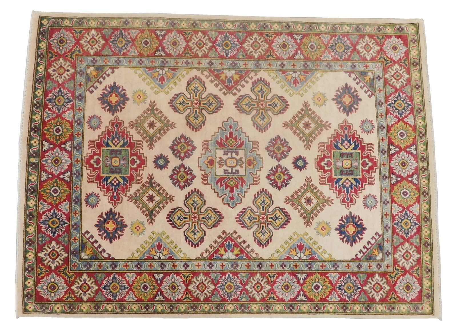 RUG: Kazak, 5' x 6' 8", c. 1990, wool on cotton, off cream ground, red border, green minor border,: RUG: Kazak, 5' x 6' 8", c. 1990, wool on cotton, off cream ground, red border, green minor border, wear consistent with age and use.