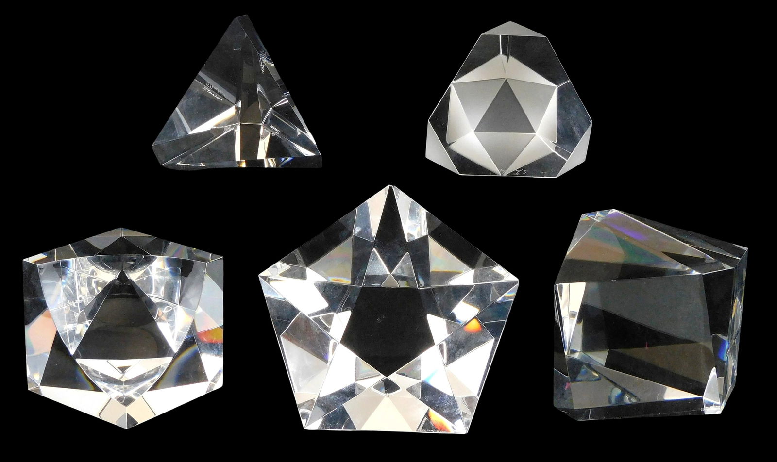 ART GLASS: Five Steuben geometric prism crystal paperweights, all signed, including: “Trigon??,: ART GLASS: Five Steuben geometric prism crystal paperweights, all signed, including: “Trigon”, pyramid shape with cut facets, 2 3/4” h. x 2 7/8” l.; “Octron”, hexagonal pri