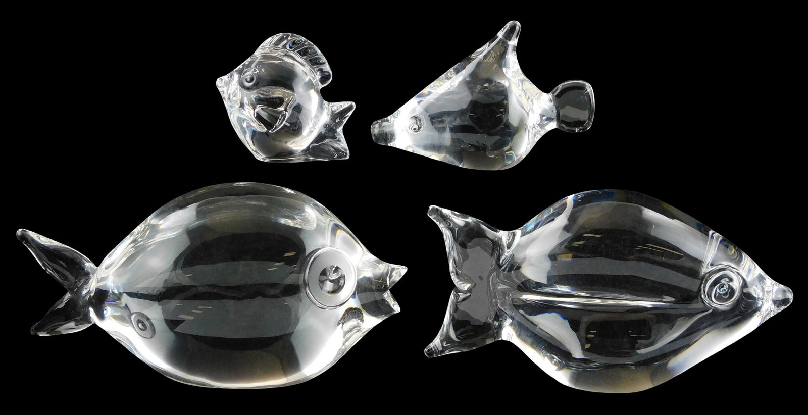 ART GLASS: Four Steuben Fish, all with signed base, including: reef fish, blue topaz eyes, concave: ART GLASS: Four Steuben Fish, all with signed base, including: reef fish, blue topaz eyes, concave sides, 3 1/2” h. x 6 3/4” l.; an open mouth fish, bulbous body with clear eyes, 3 1/2&rdq