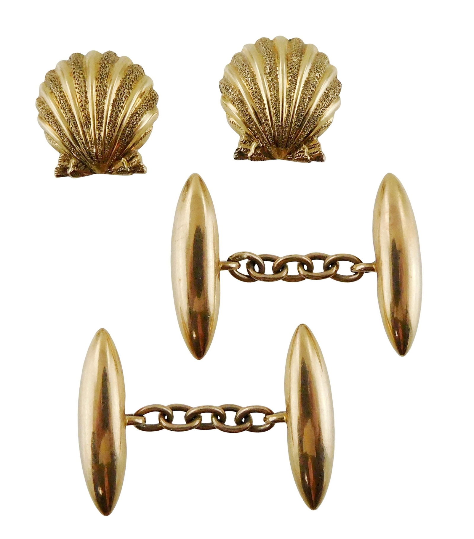 JEWELRY: 14K Gold cufflinks, two pairs, one oblong and one seashell form, both tested 14K, one: JEWELRY: 14K Gold cufflinks, two pairs, one oblong and one seashell form, both tested 14K, one stamped '15', wear consistent with age and use, sold as is. [Total Weight: 11 grams]