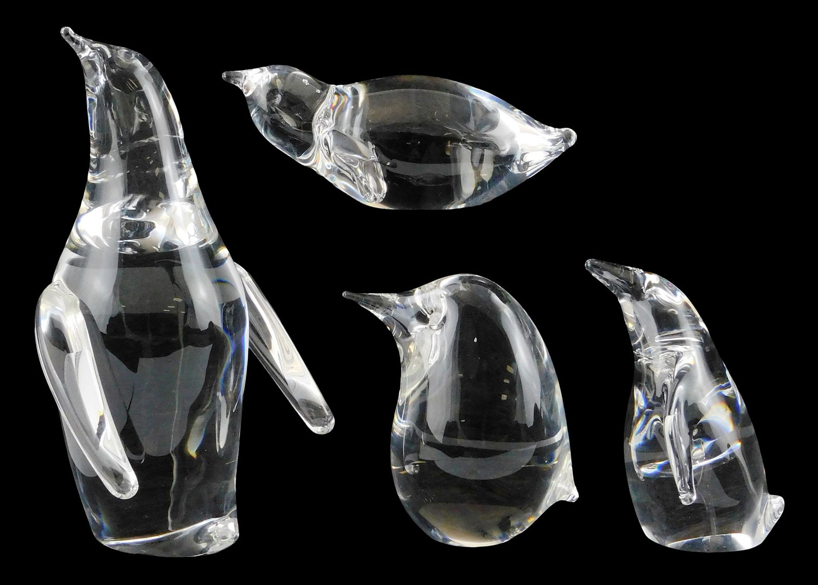 ART GLASS: Four Steuben crystal penguin figures, all signed on base, including: “Penguin??, beak: ART GLASS: Four Steuben crystal penguin figures, all signed on base, including: “Penguin”, beak pointed up and to the side, etched eyes, wings slightly outstretched, 6 1/4” h. x 3 1/2&rd
