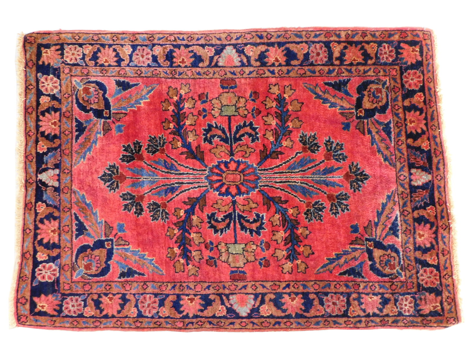 RUG: Antique Persian Sarouk, 2' 11" x 2', wool on cotton, finely woven, dusty rose ground, midnight: RUG: Antique Persian Sarouk, 2' 11" x 2', wool on cotton, finely woven, dusty rose ground, midnight navy border, center medallion, wear consistent with age and use including unraveled ends, etc., sold