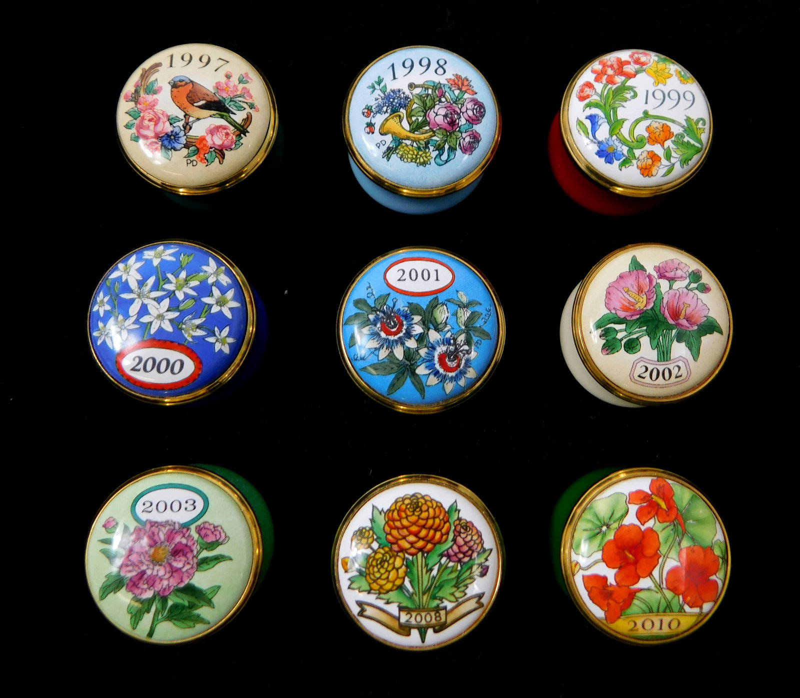 Nine Halcyon Days annual mini enamel trinket boxes, 20th C., England, including the years 1997-2003, (1 of 4)